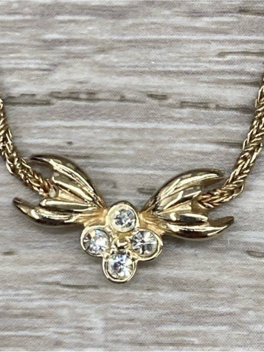 Authentic. Christian Dior Gold Flower Wing Crystal Necklace - Gold and Clear.